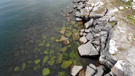 Aerial-view-over-rugged-coastline-of-Asunden-Nature-Reserve,-Sweden