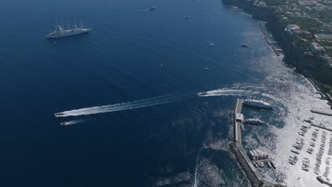 aerial footage of the mediterranean sea off the coast of sorrento with shining blue water