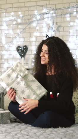 woman with presents. christmas woman with happy face and presents at new year vertical video