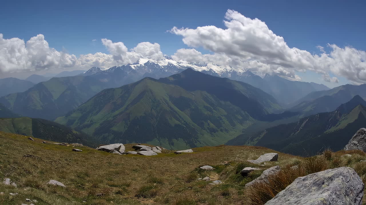 Majestic Mountain Landscape with Snow-Capped Peaks and Green Valleys