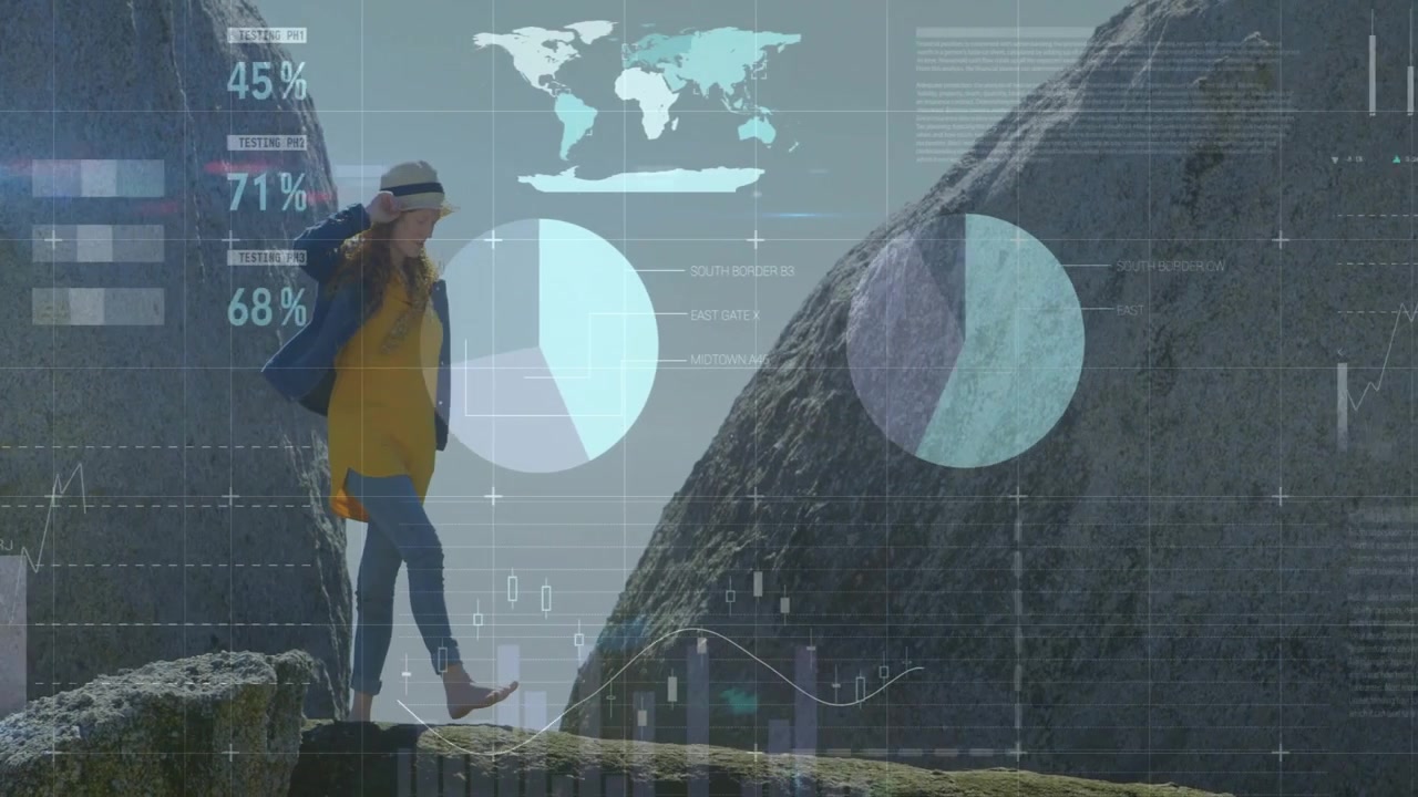 Woman navigating rock ledge holding hat as breeze stirring activating technology charts, world map