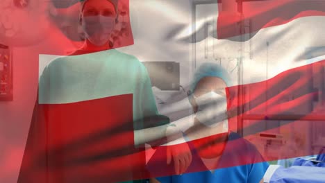 Animation-of-flag-of-switzerland-over-caucasian-surgeons-with-face-masks