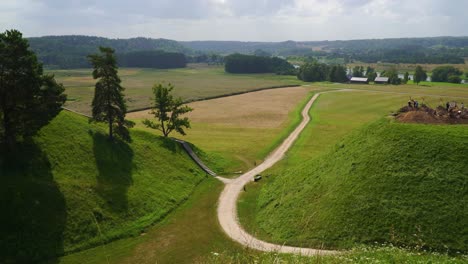 an aerial view of the rural kernave mounds in the countryside of kernave, lithuania