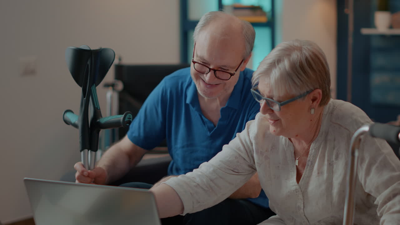Senior couple using a laptop at home