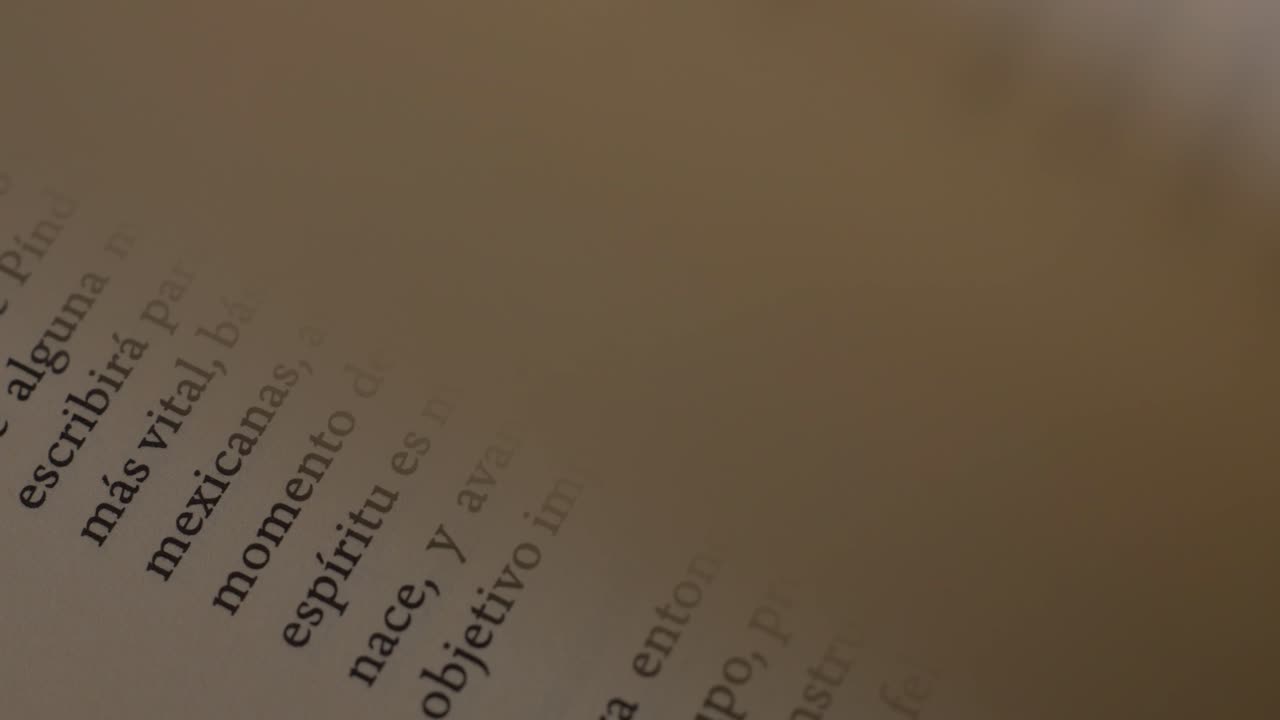 Detailed close-up of the sides of a book showing printed words on the pages