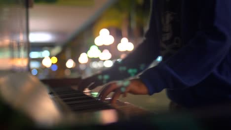 child hands playing piano 01