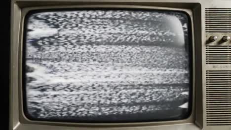 a vintage television screen displaying distorted static images, highlighting the chaos of unclear signals and representing the nostalgia of past media experiences