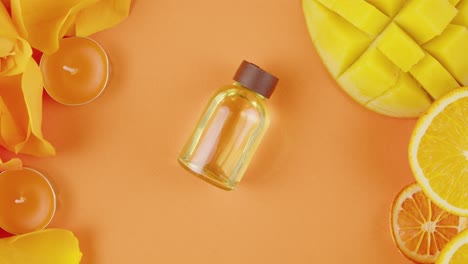 orange mango essential oil with flowers