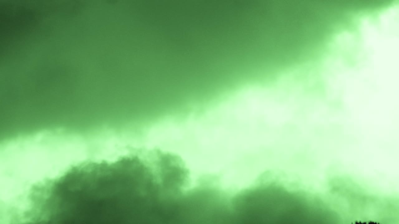 Layers of Abstract Stylised Green Clouds Passing Slowly