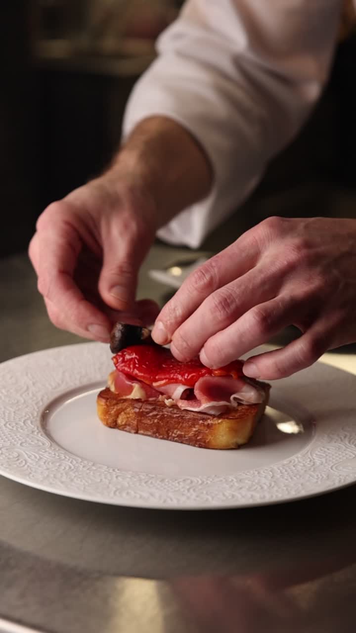 Chef's Hands Plating Gourmet Toast with Ham and Roasted Pepper