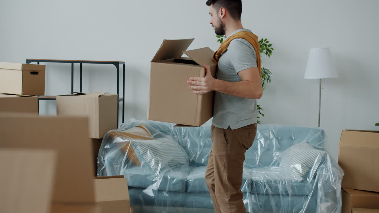 Man Moving Boxes and Furniture