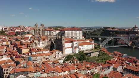 aerial drone shot of the luis i bridge, the douro river and the city of porto, in portugal