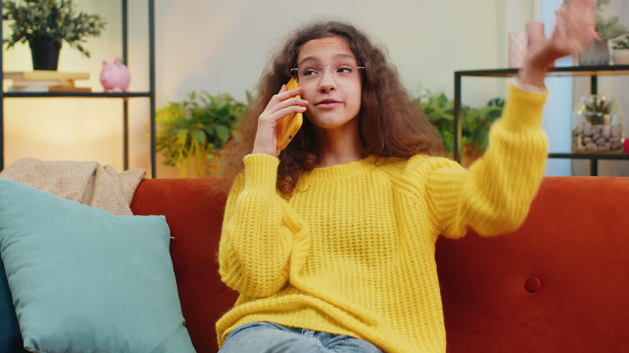 Happy surprised child girl having pleasant conversation phone call good news enjoying talking gossip