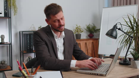 upset businessman showing thumbs down, dislike bad work, disapproval dissatisfied feedback at office