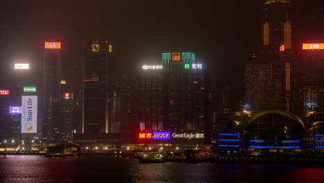 hong kong - 19 march 2025 : hong kong central city skyline filmed from across the harbour in kowloon with all the skyscrapers lit up at night advertisements