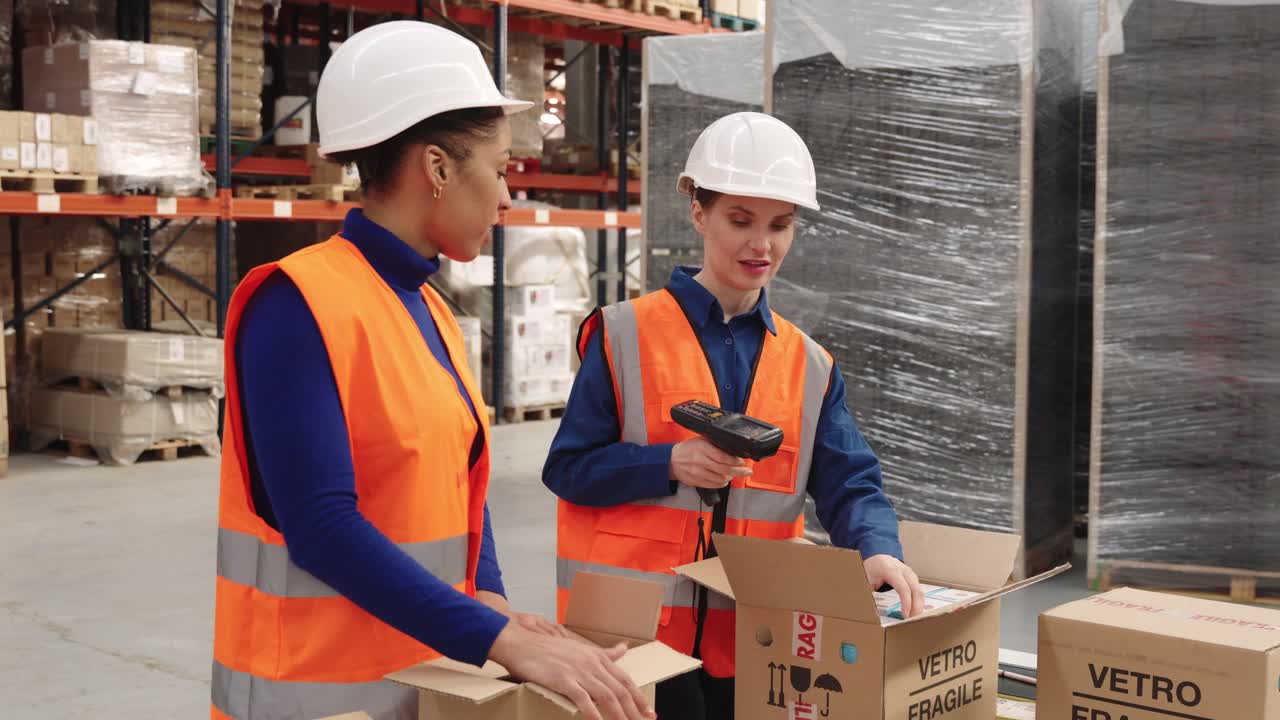 Warehouse workers scanning boxes for inventory