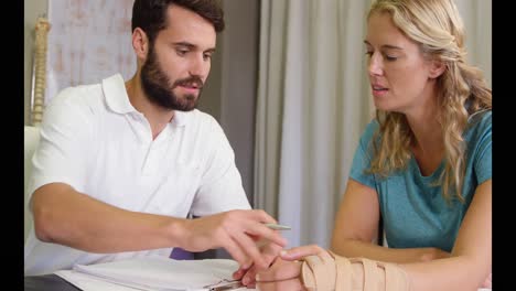 male physiotherapist examining a patient