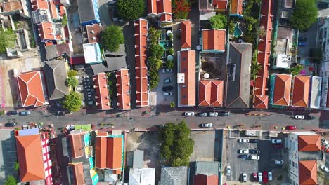 Top-down-bird's-eye-satellite-zenithal-view-of-vibrant-red-roofs-of-Willemstad-Curacao