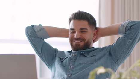 man relaxing on laptop