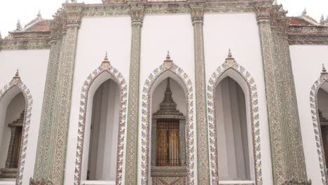 white-buddhist-temple-with-detailed-doorway-in-the-Rattanakosin-old-town-of-Bangkok,-Thailand