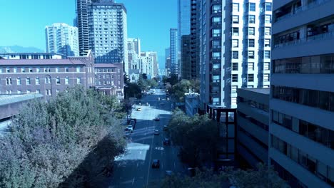 st pauls hospital downtown vancouver burrard 4k aerial drone flyover quiet sunny streets fall spring overlooking light traffic davie to see-em-ia laneway with mountains surrounding city skyscrapers