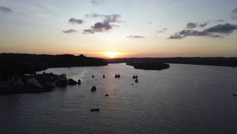 aerial: vessels anchored on the coastline of itacare, dramatic dusk in brazil