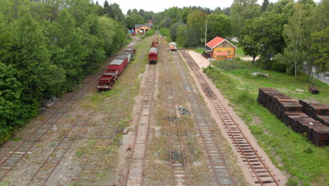 A-drone-footage-of-a-train-station-with-old-train---railcars