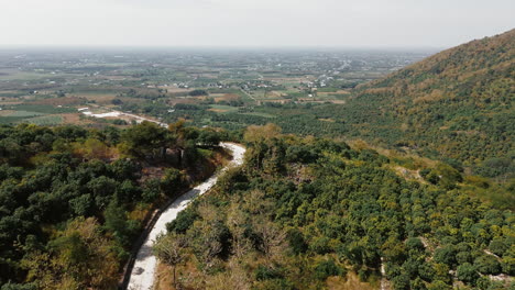 mountainous landscape with winding road and valley views