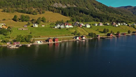 Aerial-over-Syvde-waterfront-on-a-lovely-sunny-day,-Vanylven-Municipality,-Norway