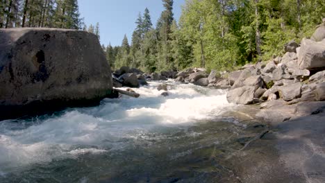 swift waters of icicle creek flowing around huge boulders