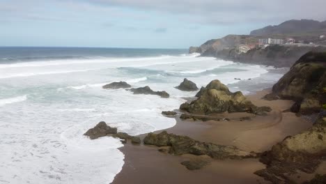 Aerial-drone-view-of-the-beach-of-Bakio-in-the-Basque-Country-in-a-foggy-day