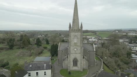 clones church in monaghan, ireland, overlooking the town, with overcast skies, aerial view