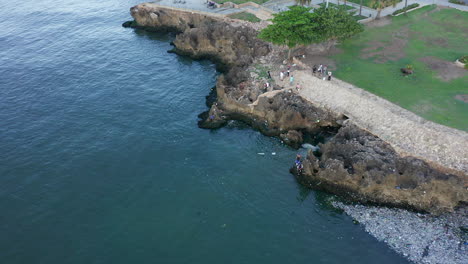 pollution on rocky coast of malecon at santo domingo