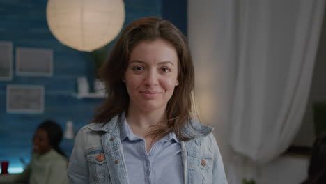 Close-up-of-woman-portrait-looking-into-camera-while-drinking-beer