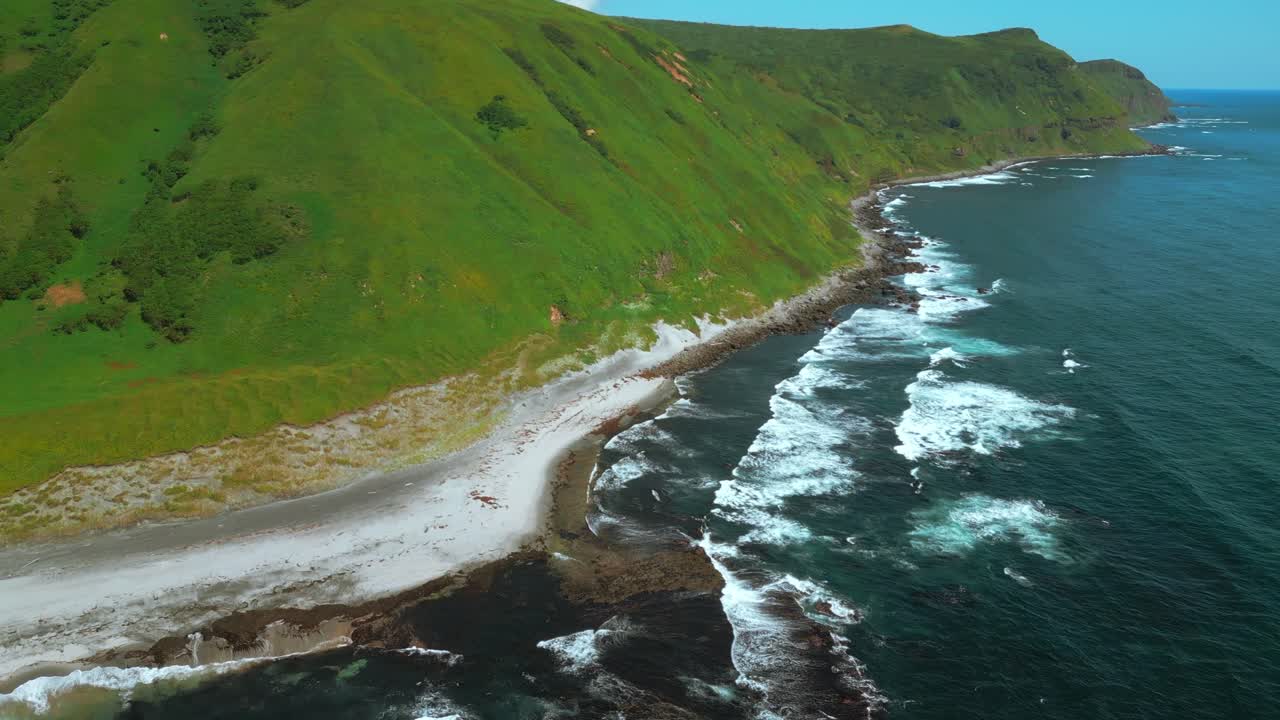 Coastal Landscape with Rolling Hills and Waves