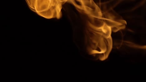 flames of fire on black background in slow motion