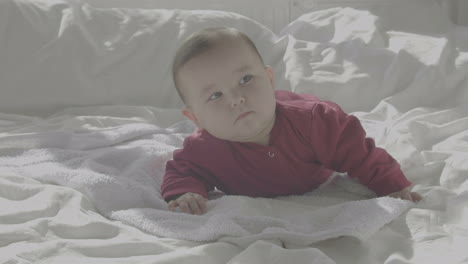 cute baby lying on a cozy bed