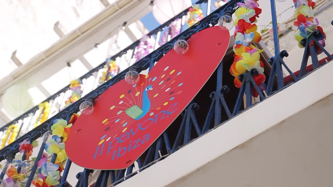 Sign with peacock and flowers