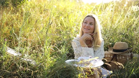 woman painting outdoors in a golden field