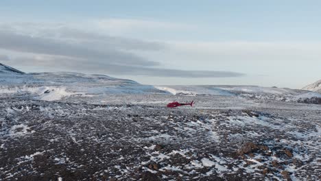 arctic wilderness in iceland with helicopter stranded on hill at reykjanes