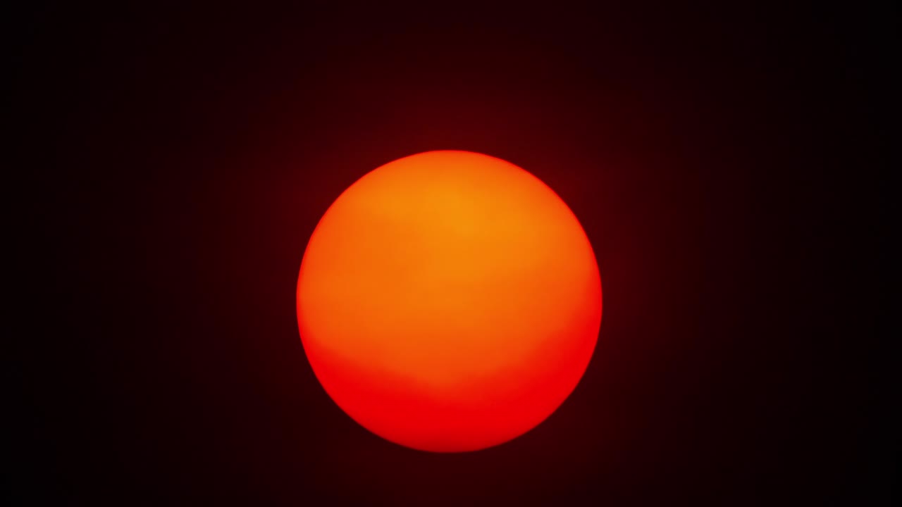 Red sun sphere in thick smog