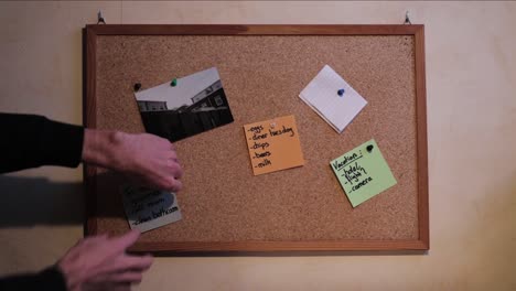 tagging a bloknote with a pushpin on a bulletin board!