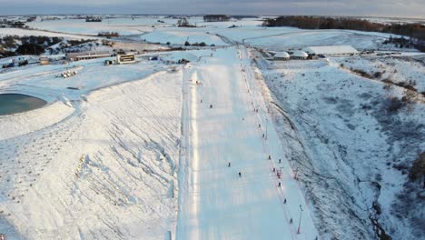 Small ski slope with wintery snowy surroundings