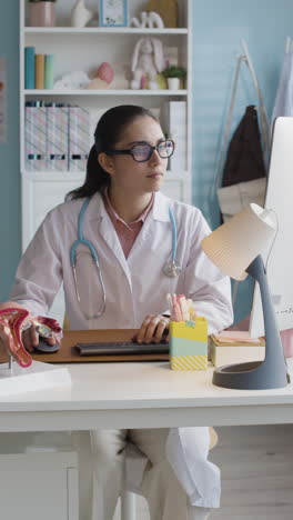 doctor working in her office