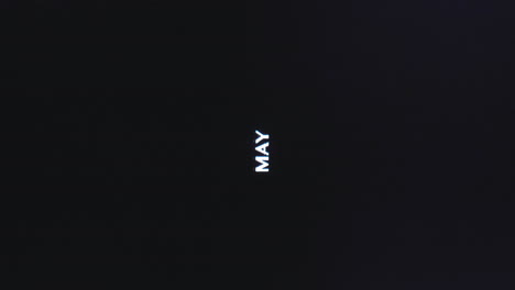 vertical word for month of may glitch out and spread, sans serif capital letters