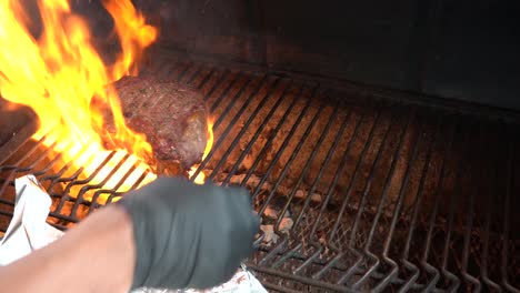 a cowboy rib-eye steak gets thrown on the grill to sear