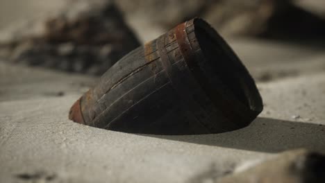 old wooden barrel on the beach