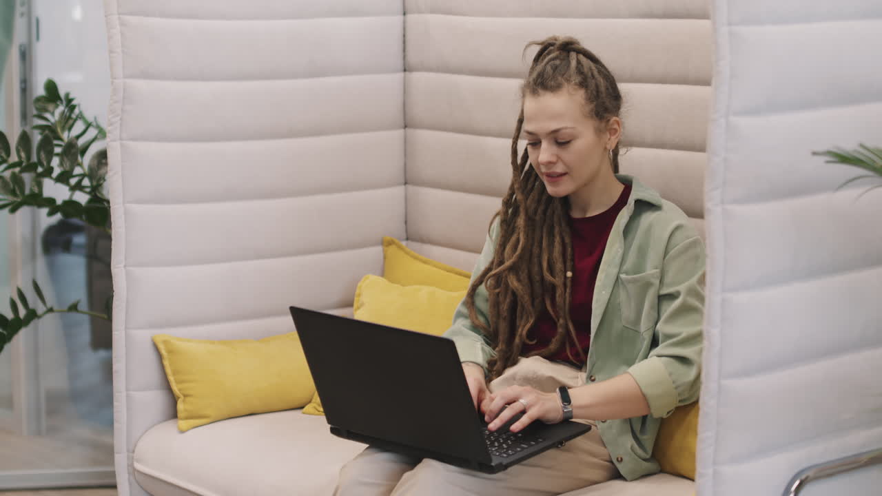 Young Businesswoman with Dreadlocks Working