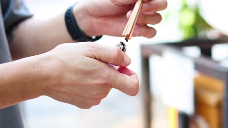 sequential lighting of incense stick with lighter