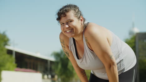 static shot of hard breathing woman finished morning workout